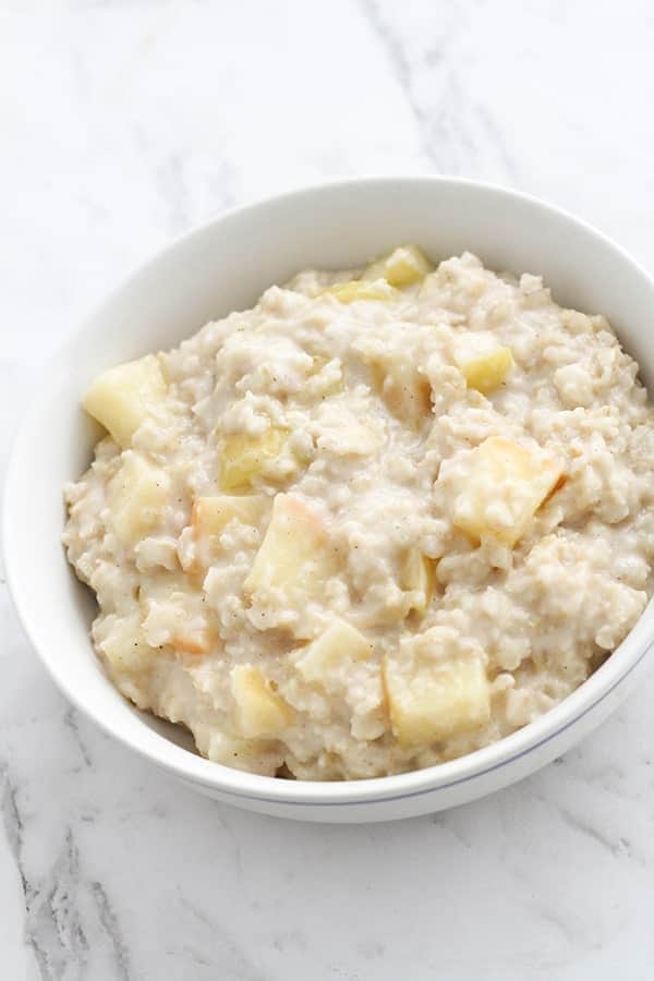 apple cinnamon oatmeal in a white bowl.