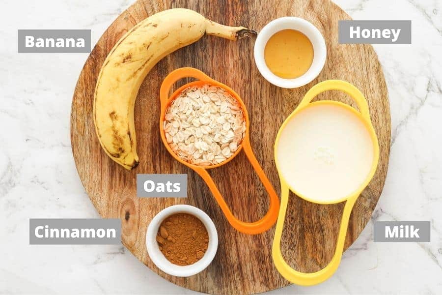 ingredients for banana porridge on top of a wooden board.