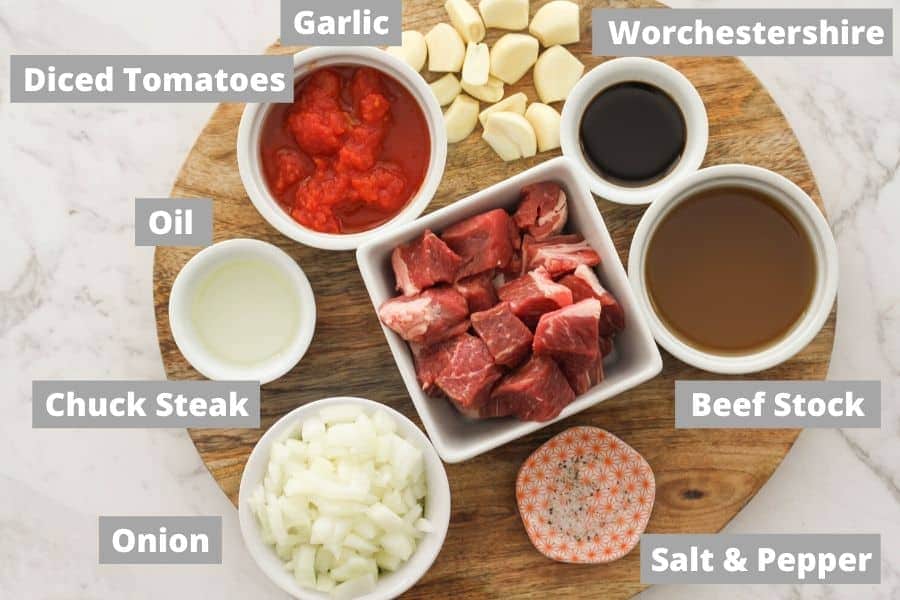 braised beef ingredients on a wooden board.