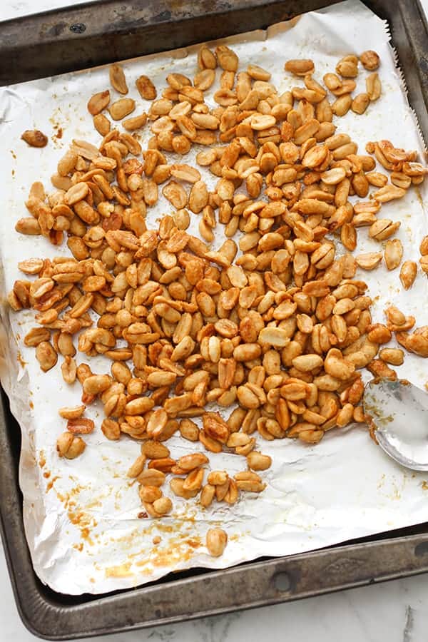 roasted peanuts on a baking tray.