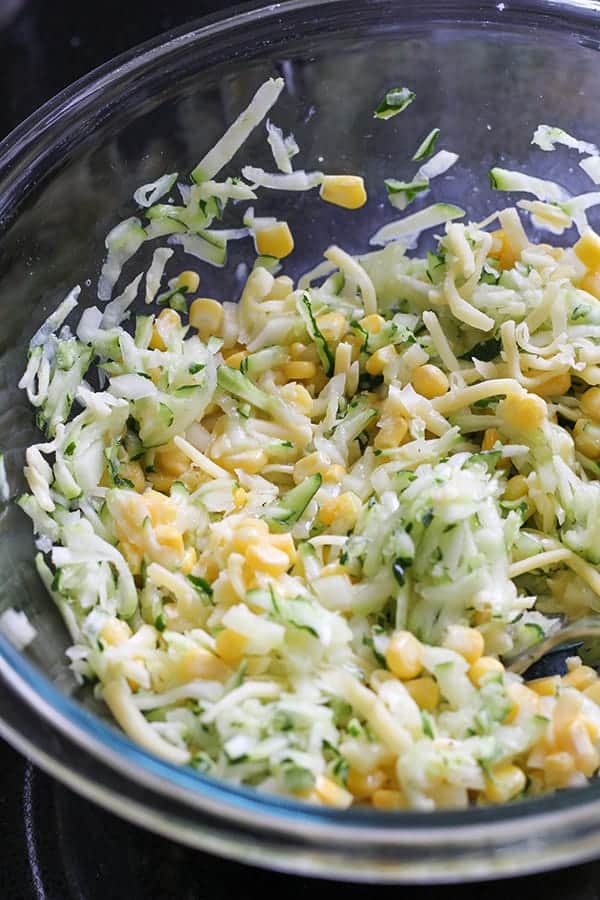 fritter ingredients in a glass mixing bowl.