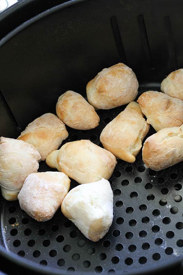 pretzel bites in an air fryer basket.