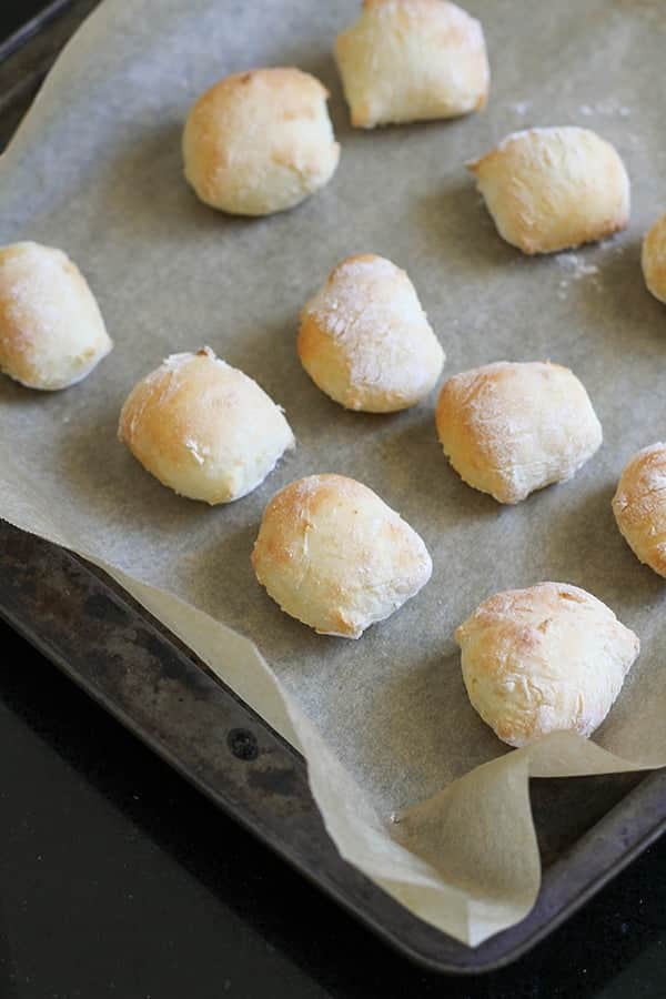 cooked pretzel bites on a baking tray. 