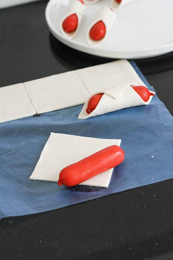 cocktail frankfurt laid on top of a piece of puff pastry.