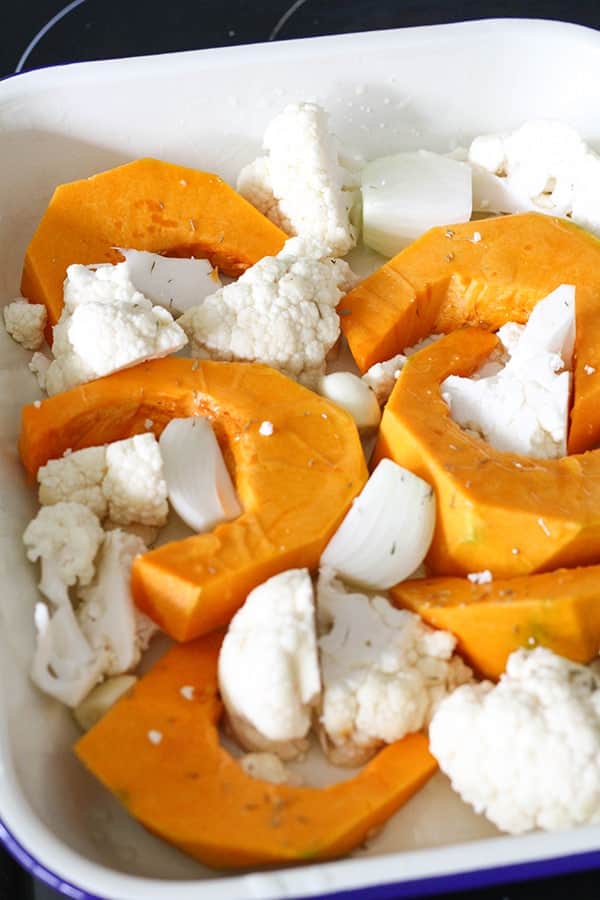 pumpkin and cauliflower in a baking tray.