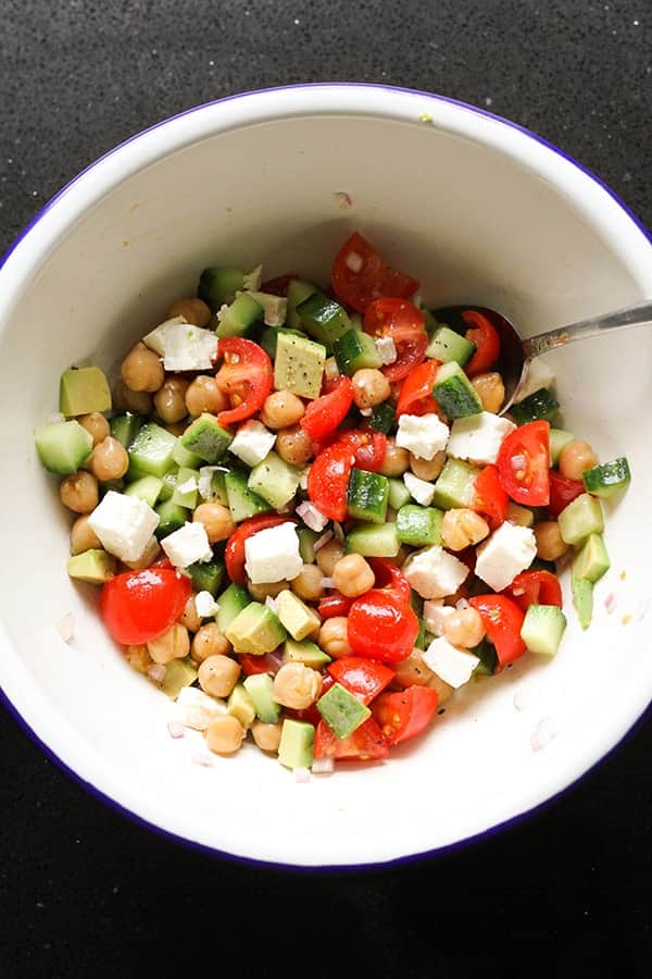 chickpea salad in a white bowl.