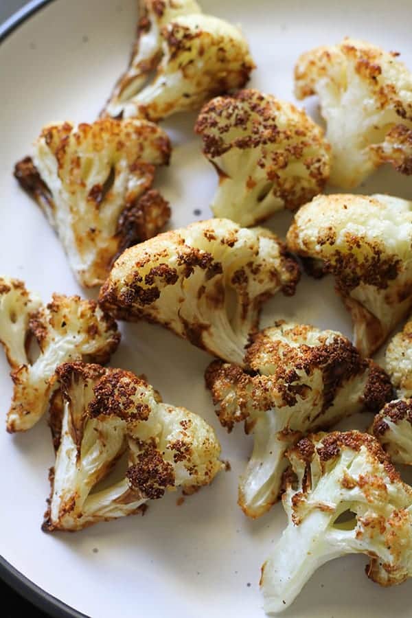 roasted cauliflower on a white plate.