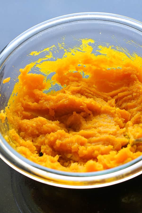 mashed pumpkin in a glass bowl.