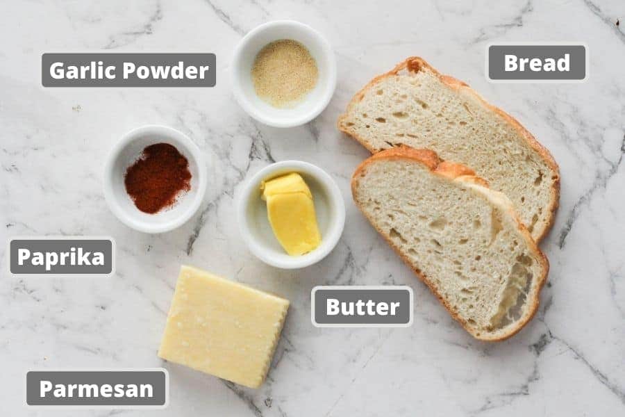 ingredients for sizzler cheese toast including sourdough bread, parmesan cheese and butter.