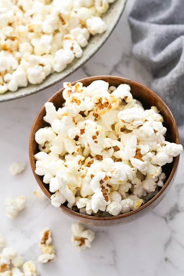 popcorn in a brown bowl.