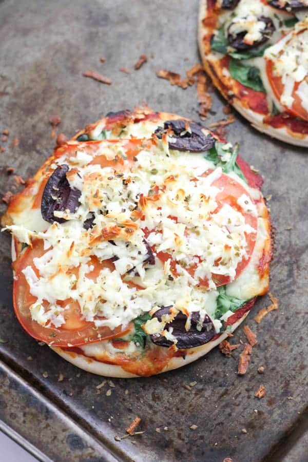 cooked pizzas on a baking tray.