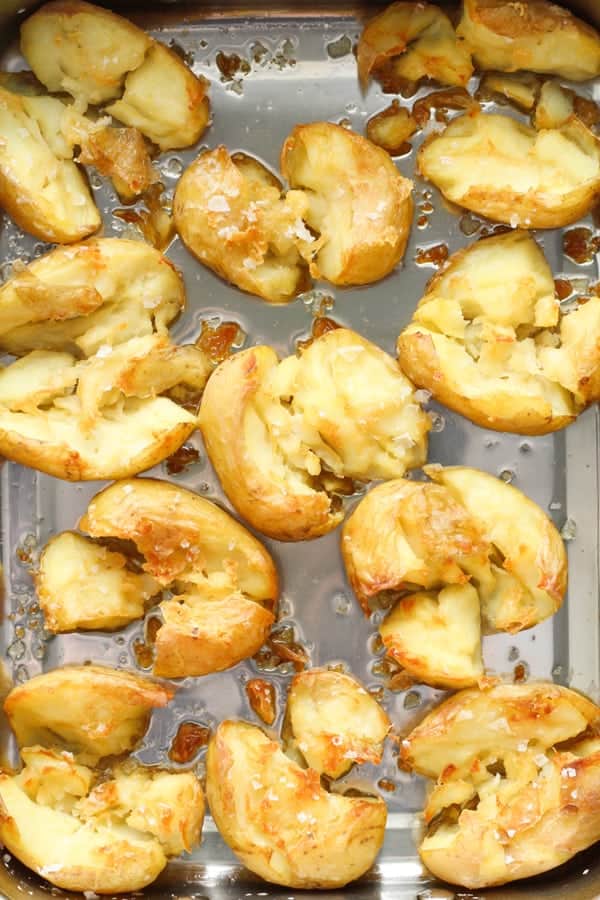 glass potatoes in a roasting pan.