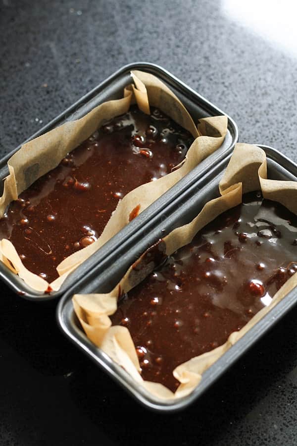 air fryer brownies mixture in two mini loaf pans.