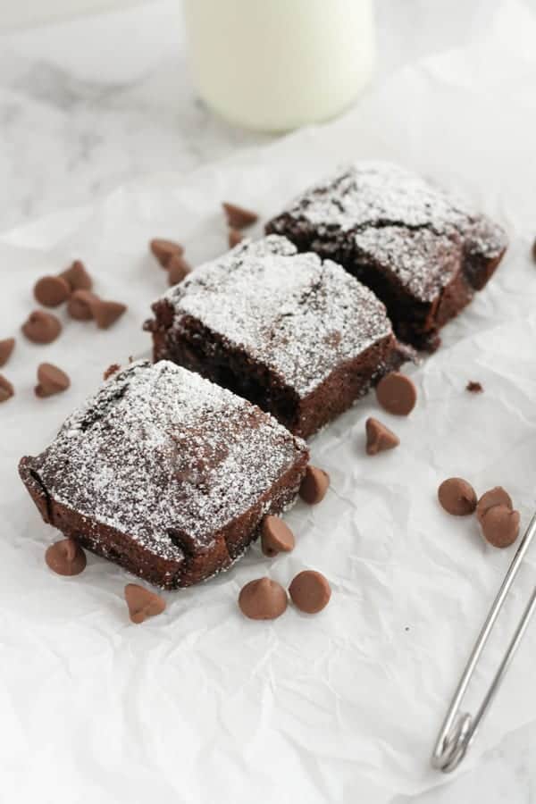 chocolate brownie slices on top of white baking paper.