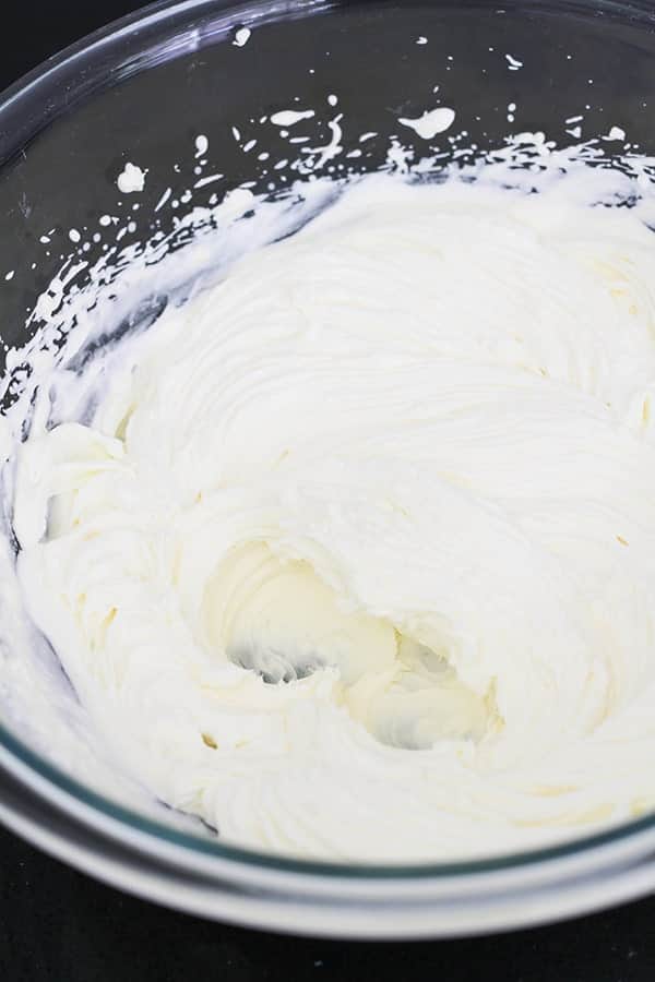 whipped cream in a glass bowl.