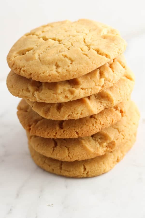 golden syrup cookies stacked on top of each other.