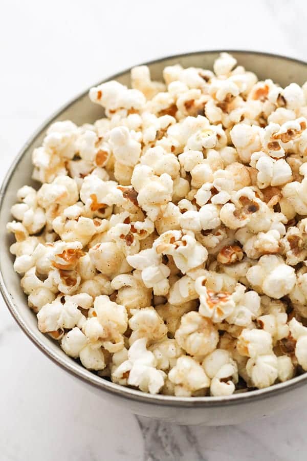 cinnamon sugar popcorn in a grey bowl.