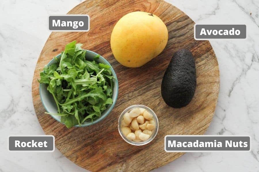 salad ingredients on a wooden board.
