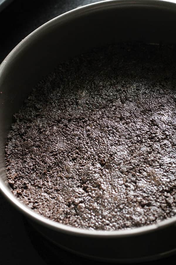 oreo cookie base in a springform pan.