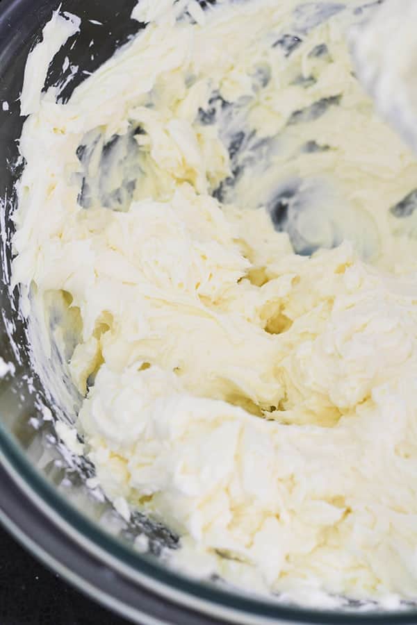 whipped cream cheese and sugar in a bowl.