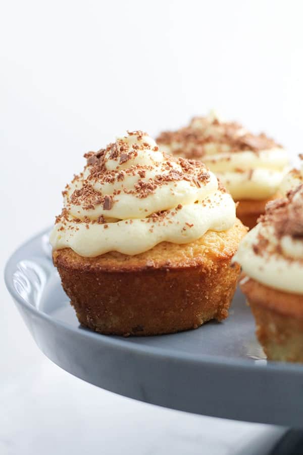 white chocolate mud cupcakes on a cake stand.