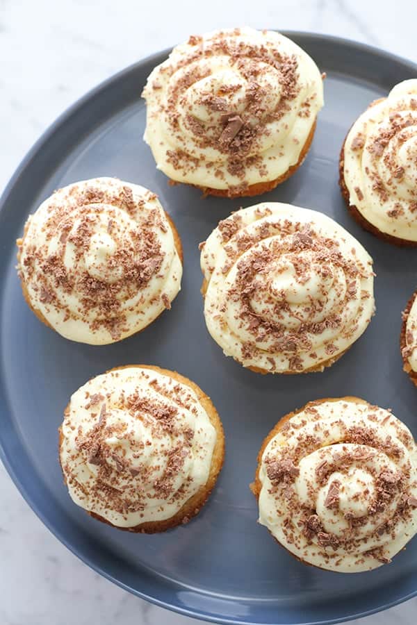 white chocolate mud cupcakes on a cake stand.