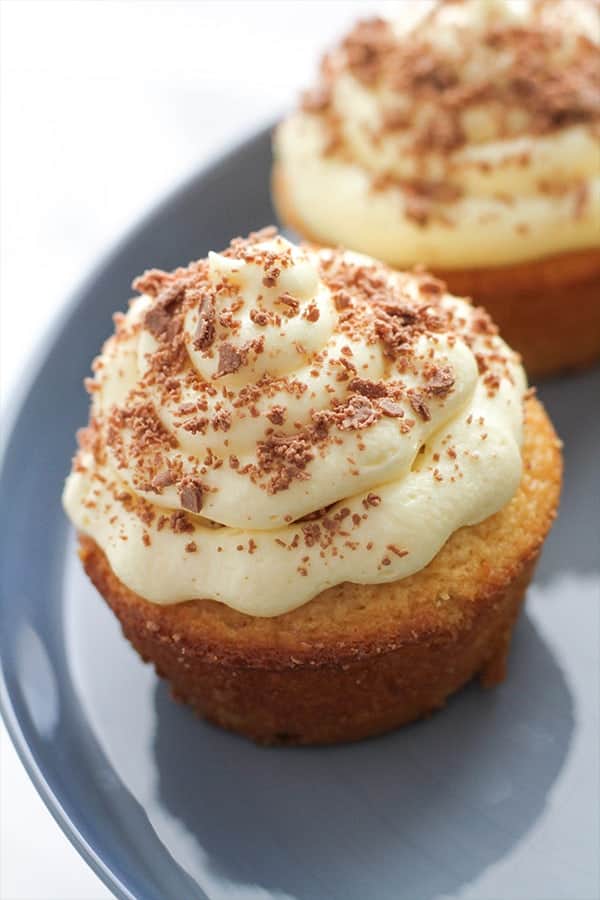 white chocolate mud cupcakes on a cake stand.