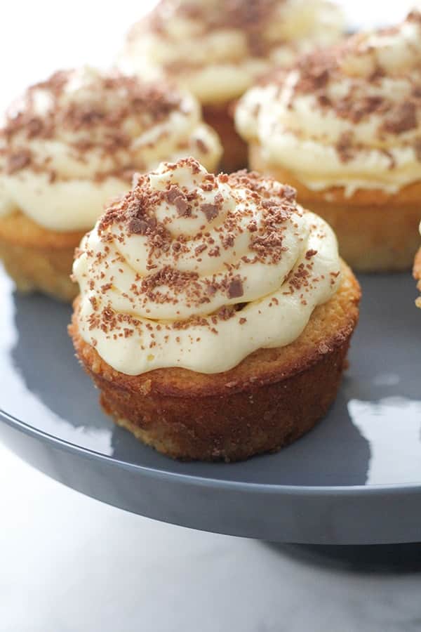 white chocolate mud cupcakes on a cake stand.