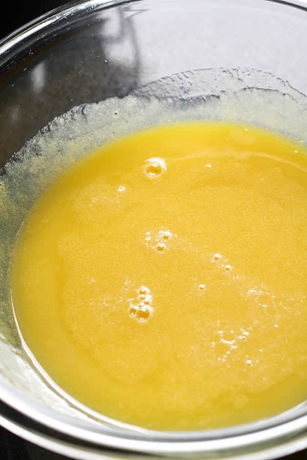 butter, chocolate and sugar melted in a glass bowl.