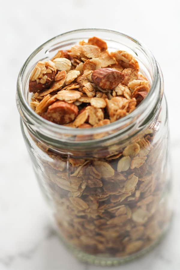 air fryer granola in a glass jar.
