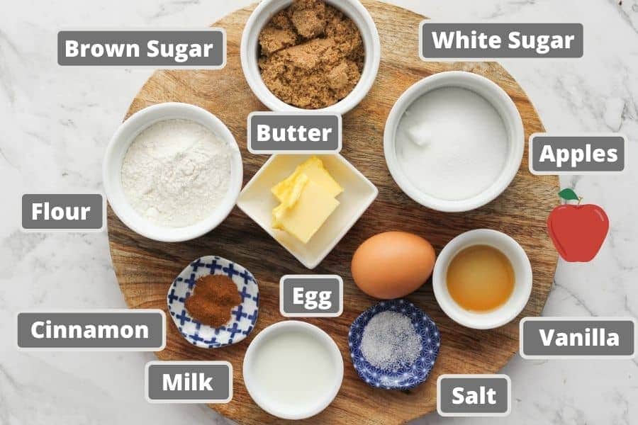 apple crumble muffin ingredients on a wooden board.