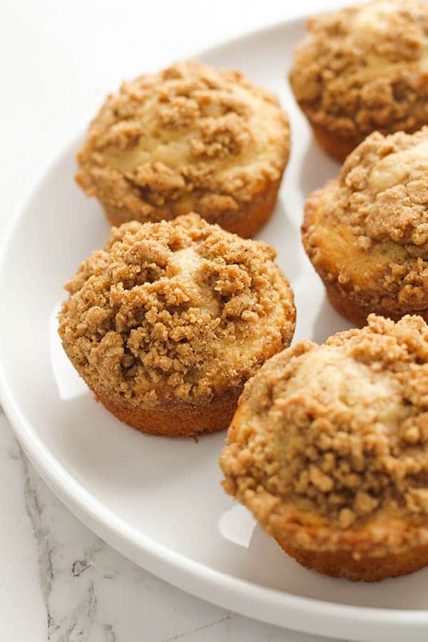 cinnamon muffins on a white plate.