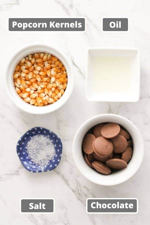 chocolate popcorn ingredients including popcorn kernels and chocolate.