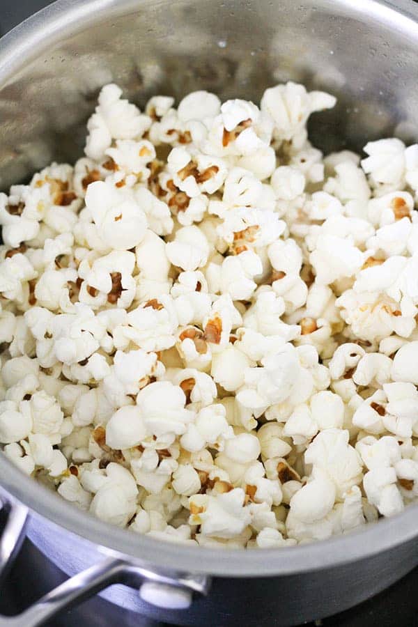 freshly popped popcorn in a saucepan.