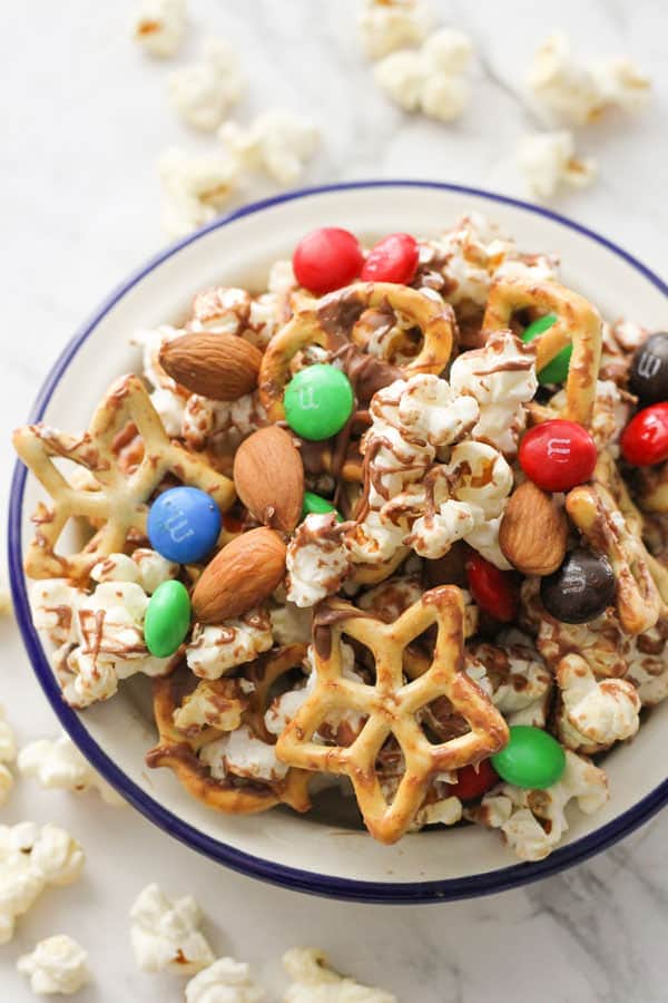 popcorn trail mix in a white bowl.