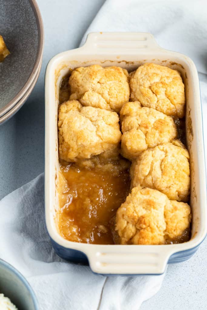 golden syrup dumplings in a baking dish.