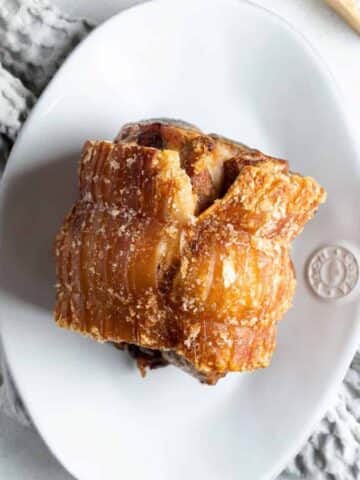 air fryer roast pork on a white platter.