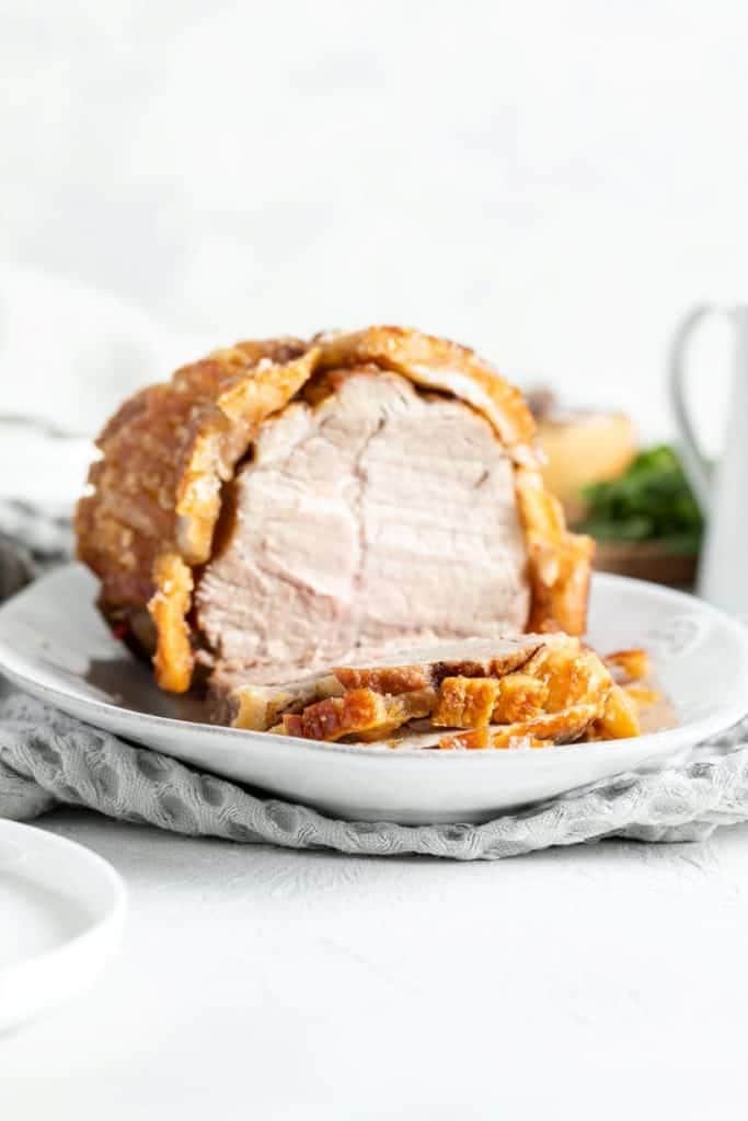 pork roast sliced on a serving platter.
