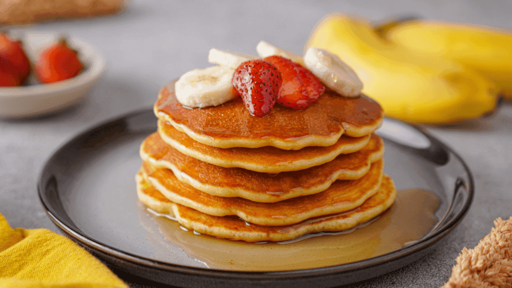 Fluffy protein Pancake with banana and strawberries