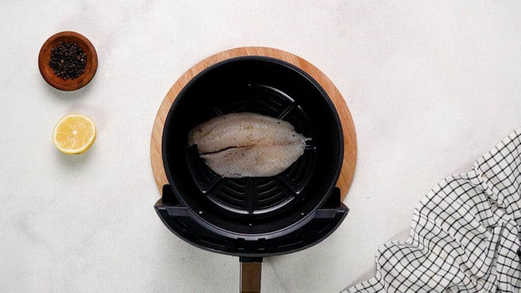 Tilapia fillet in air fryer basket