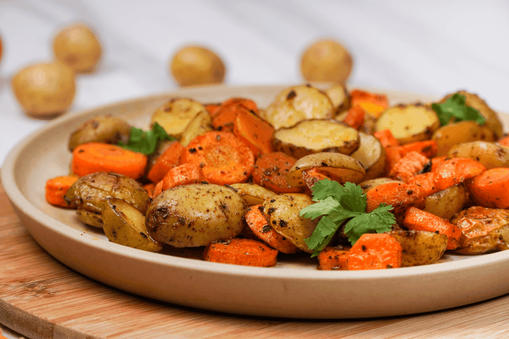 roasted potatoes and carrots on the plate