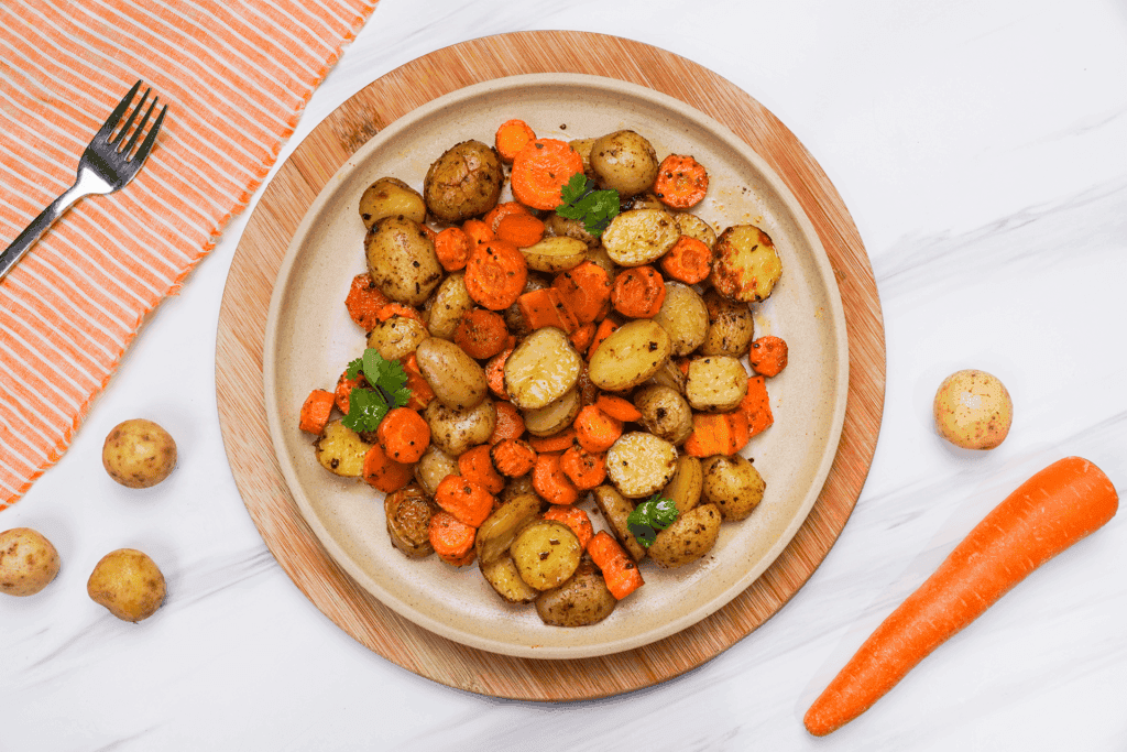 roasted potatoes and carrots on the plate