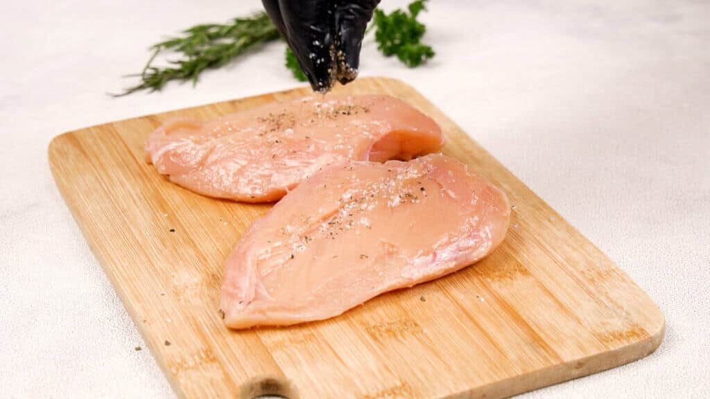 chicken fillet on the wooden tray