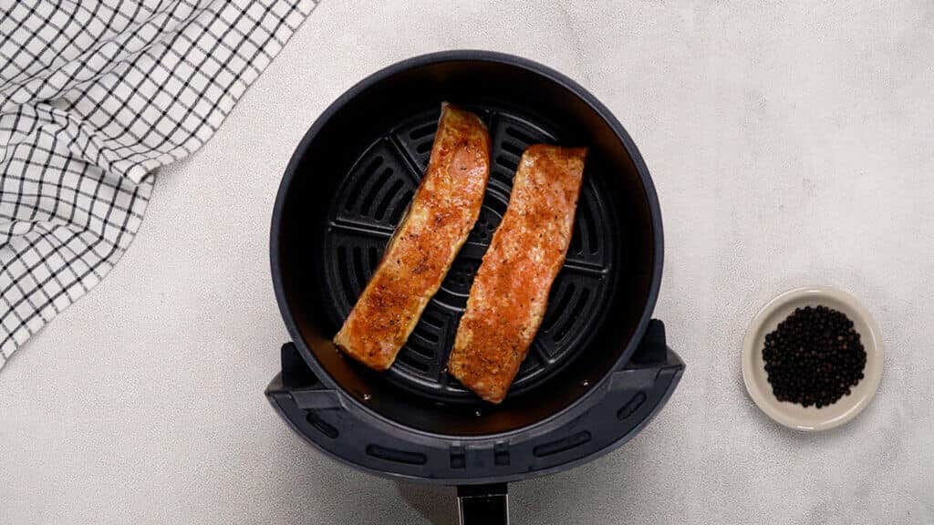 Place the salmon in air fryer