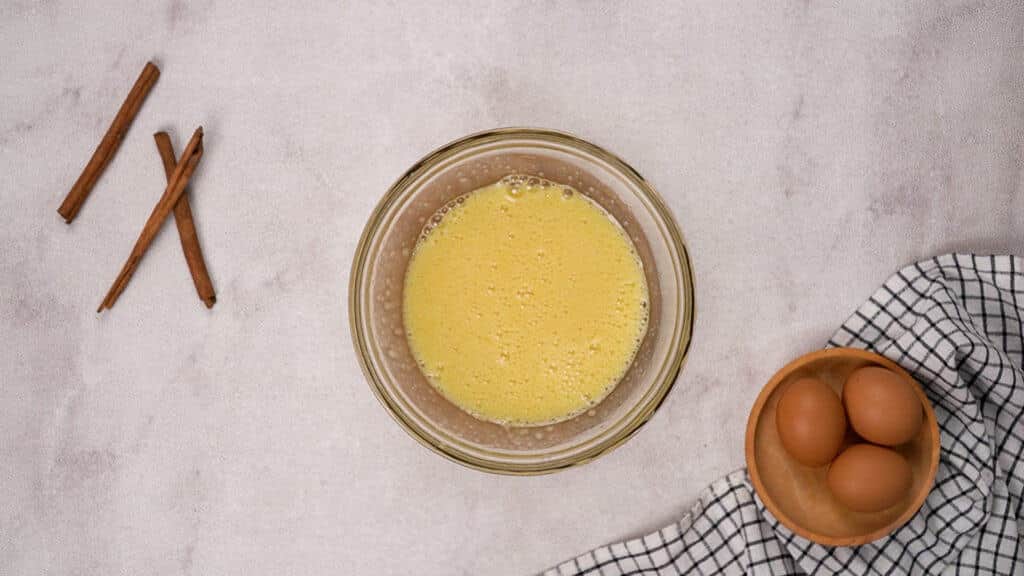 Whisked sugar and egg in a bowl
