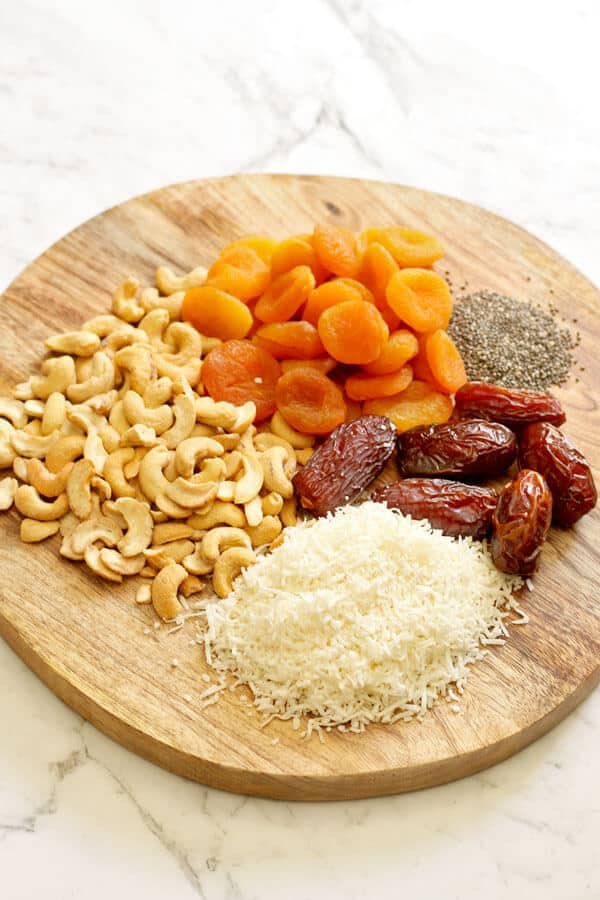 No Bake Apricot Coconut Bites Ingredients on a Wooden Chopping Board