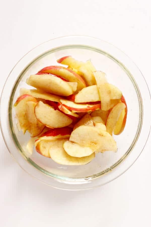 sliced apples in a glass bowl