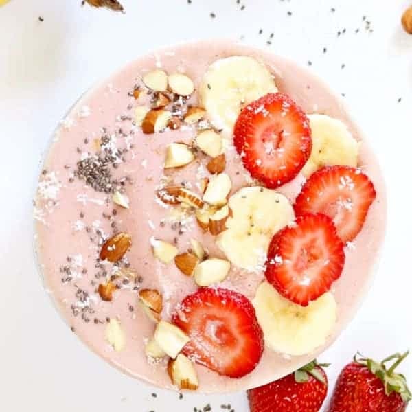 strawberry banana smoothie bowl with toppings