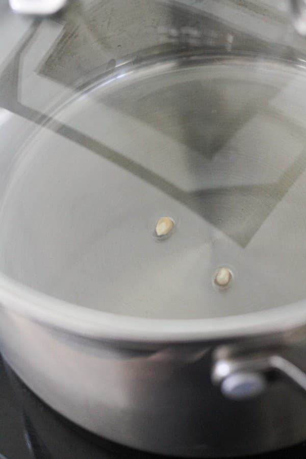 unpopped kernels in a saucepan.