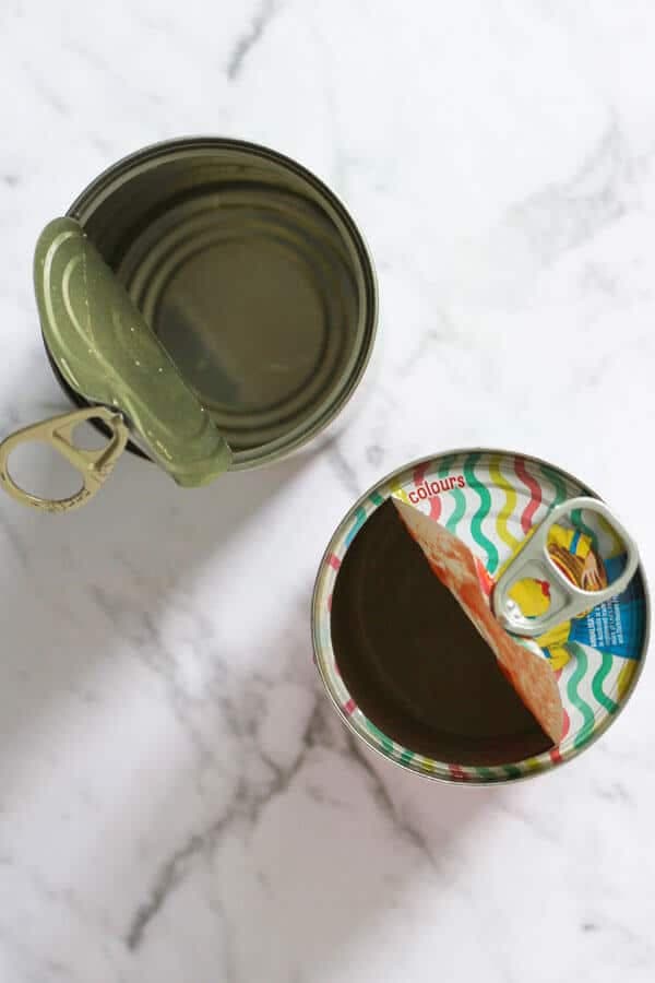 two empty cans of tomatoes